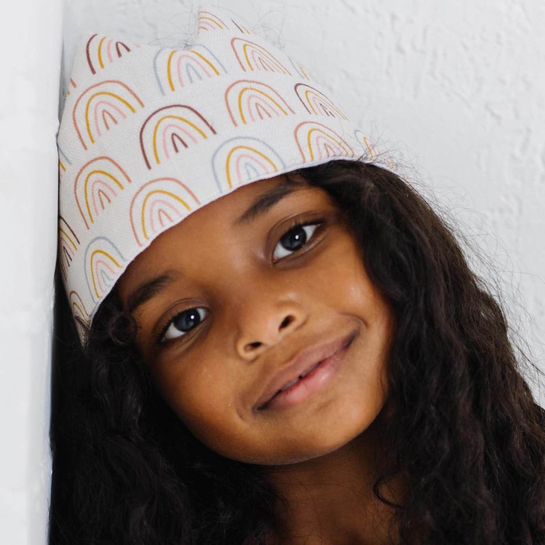 Picture of a girl wearing a birthday crown that is made with a sewing pattern for sale from Madly Wish
