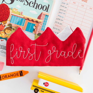 RED FABRIC CROWN WITH FIRST GRADE EMBROIDERED IN WHITE FOR LAST DAY OF KINDERGARTEN FROM MADLY WISH