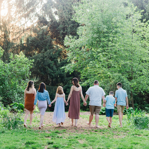 family of 7 walking in the woods