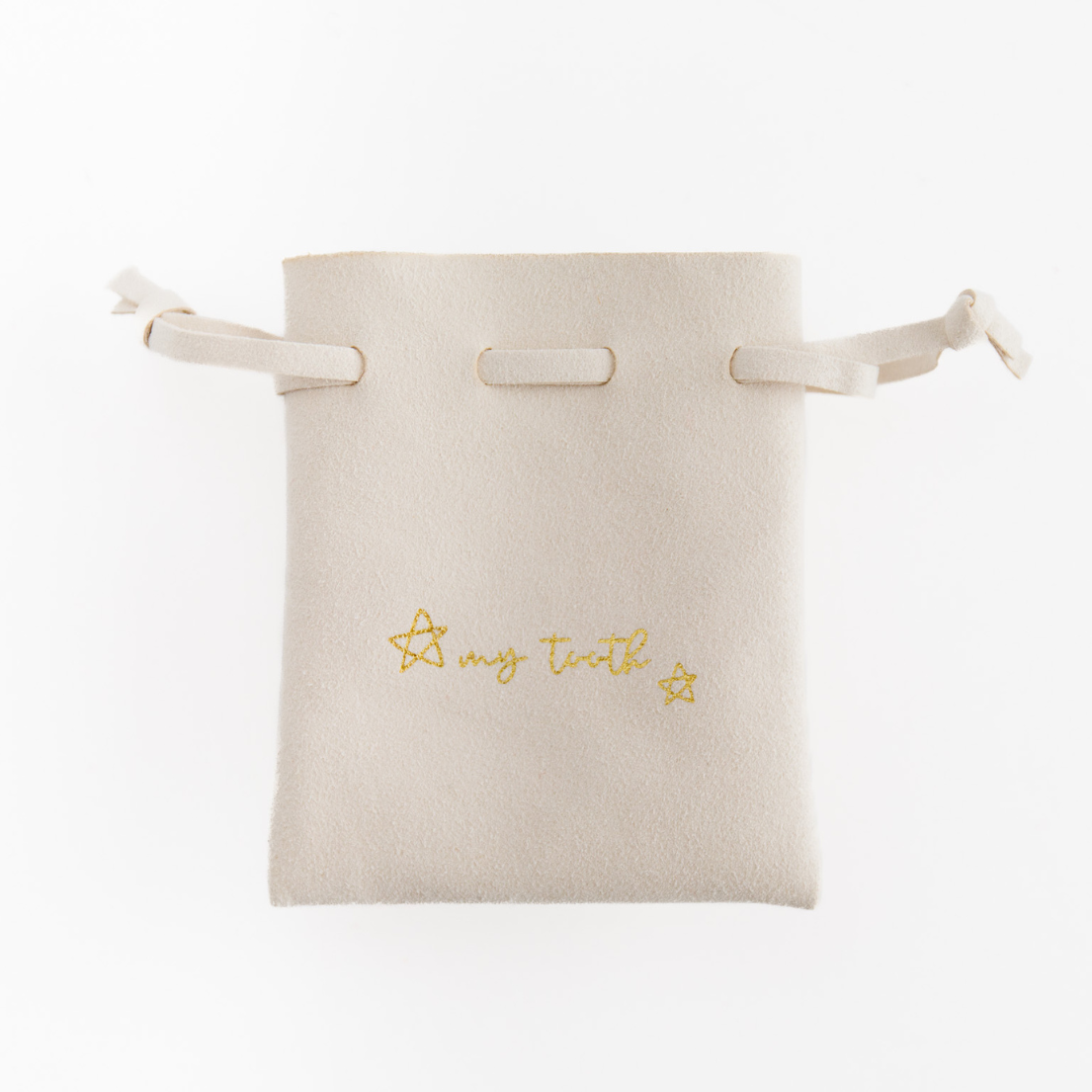 cream suede drawstring tooth fairy pouch with my tooth on the front from Madly Wish