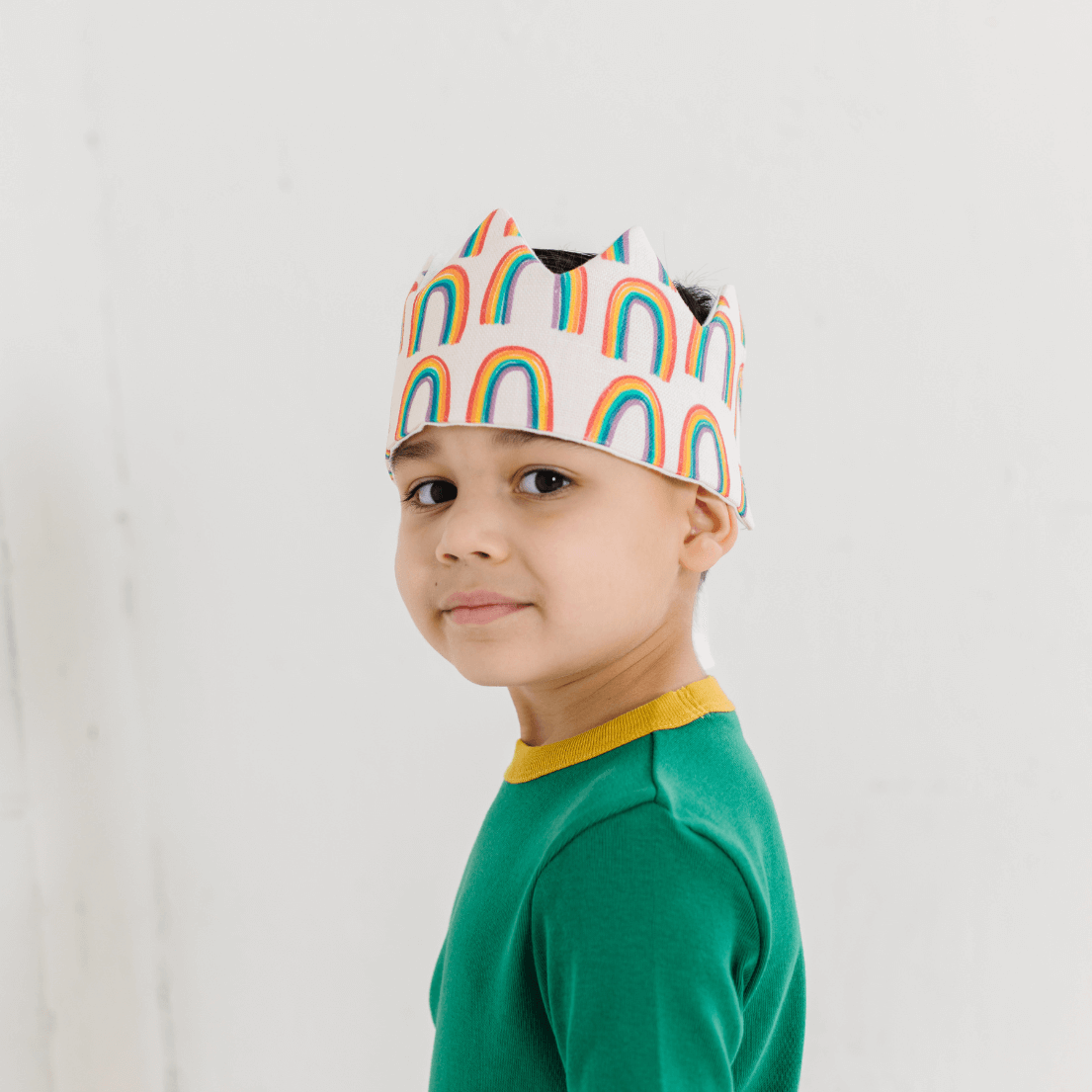 BOY WEARING RAINBOW HAT