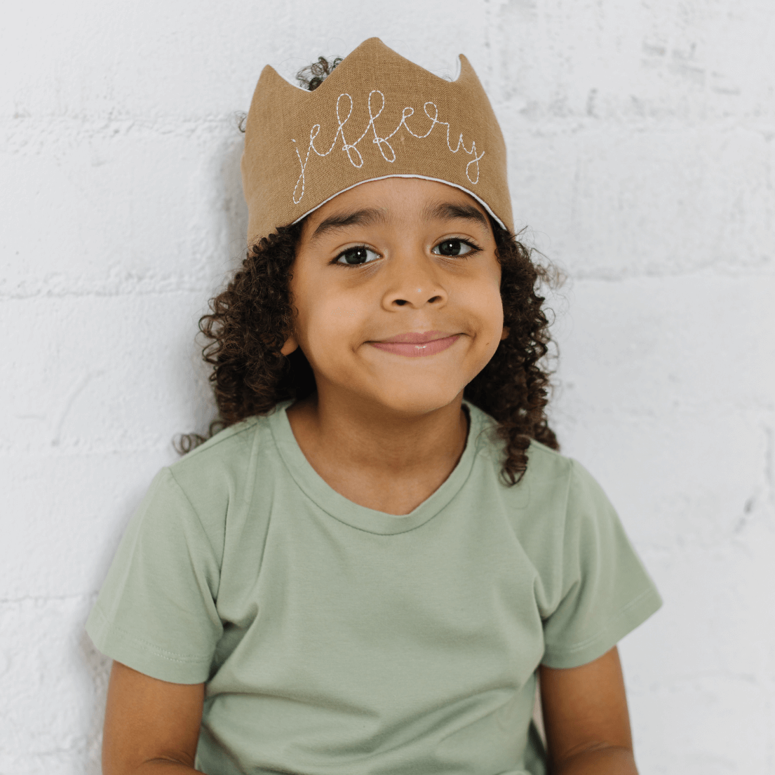 boy in personalized brown birthday crown