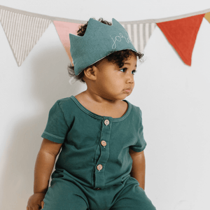 Toddler boy first birthday in green crown
